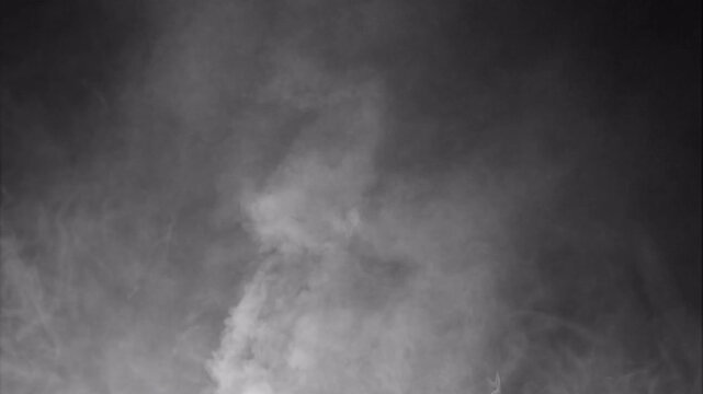 Abstract monochromatic smoke background with swirling light patterns.