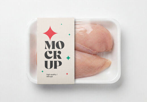 Top view of raw chicken breast fillets in a white plastic tray package mockup with a cardboard sleeve isolated on a solid white background