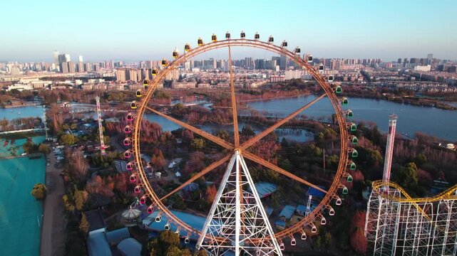 Giant Ferris Wheel and Roller Coaster Beside City Lake