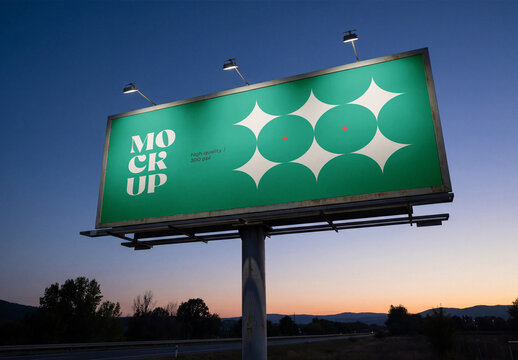 Low-angle perspective view of a massive outdoor billboard mockup with spotlights on a steel pillar structure next to a highway at sunset or twilight dawn