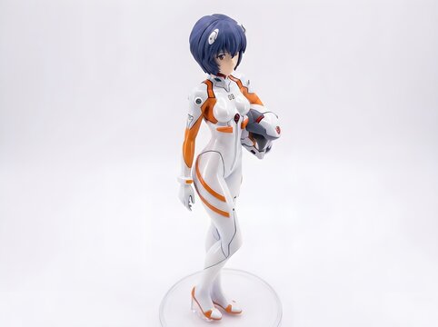 Anime figurine of a female character in a white and orange spacesuit holding a helmet, standing on a clear base against a light background
