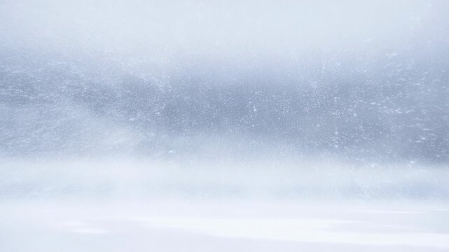 Blustery snowstorm sweeps across winter landscape in dynamic weather scene