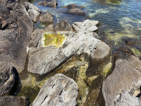 Natural rock pool among granite formations at Samil Beach in Vigo Galicia Spain