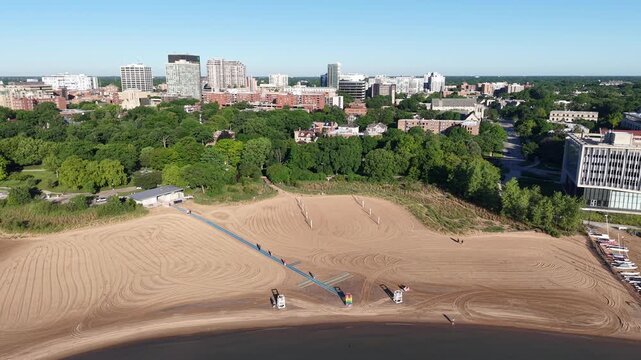 Aerial Pull-Back Over Clark Street Beach and Downtown Evanston Skyline Illinois