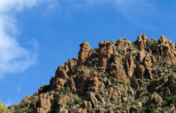 Rocky volcanic formations of C&aacute;ncarix under blue sky in Albacete, Spain.
