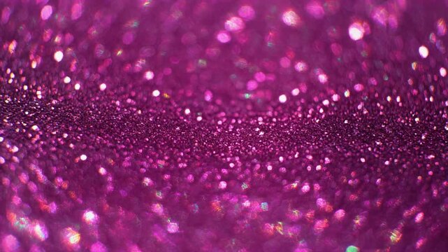 Pulsing pink bioluminescent cells in dark microscopic view