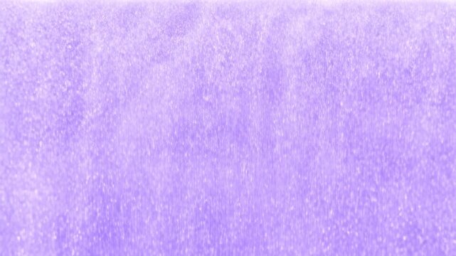 Gentle water flow creating dynamic patterns in soft purple hue