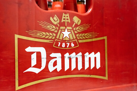 Barcelona, Spain-June 12, 2026. Close up of damm beer crate logo