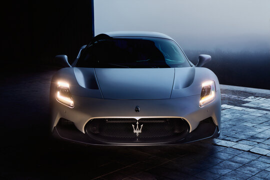 Maserati MC20 parked in a dark aircraft hangar. 3.0L V6 Twin Turbo engine, 630 HP, 730 Nm, 325 km/h.  Katowice, Poland, 09.23.2021