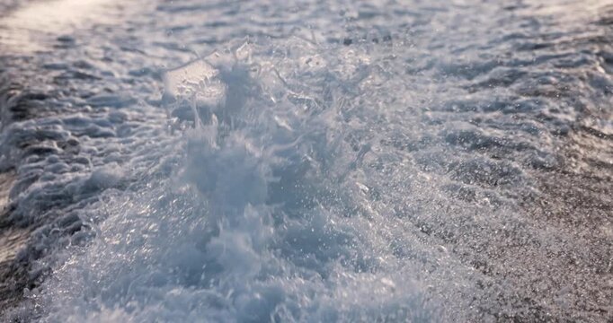 White foamy wake left by boat closeup