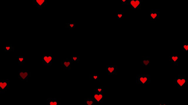 Red hearts falling down against a dark black background. love heart 4k video,pink and red hearts gracefully falling on a alpha channel. Social media love emoji particles moving. 