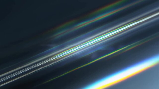 Tracking shot of light streaks sliding diagonally across reflective abstract background in dark studio with prism refraction and iridescent spectrum effects