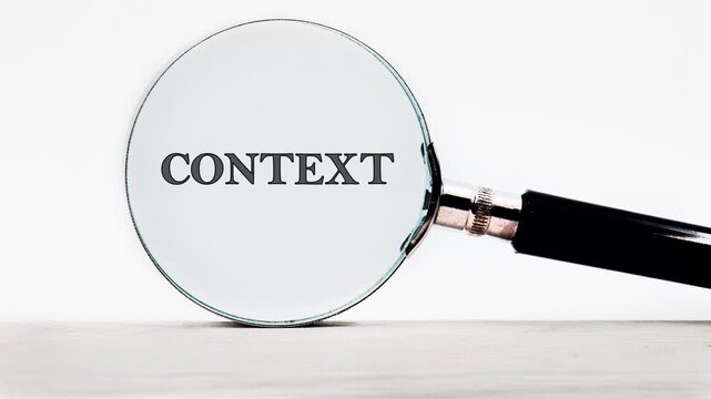 A magnifying glass shows words clearly and reveals hidden meanings. Different angles highlight how context changes understanding of language