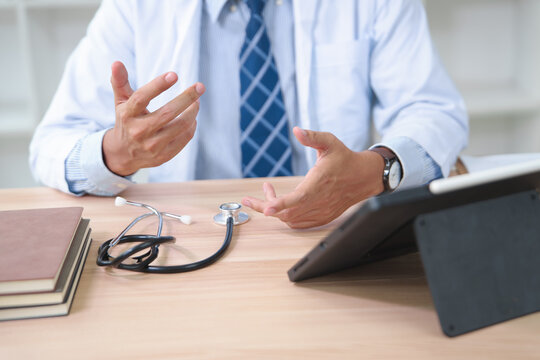 Doctor Explaining Medical Diagnosis During Consultation