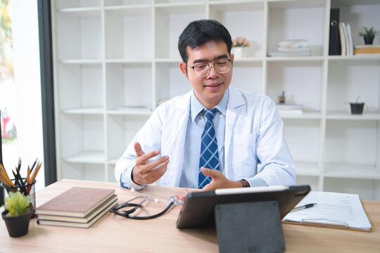Telemedicine Consultation with a Doctor Using a Tablet in a Modern Office Environment