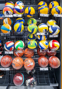 Voronezh, Russia - April 11, 2026.Grid display of Demix, Mikasa, and Molten volleyballs and basketballs in a Russian sports retail store