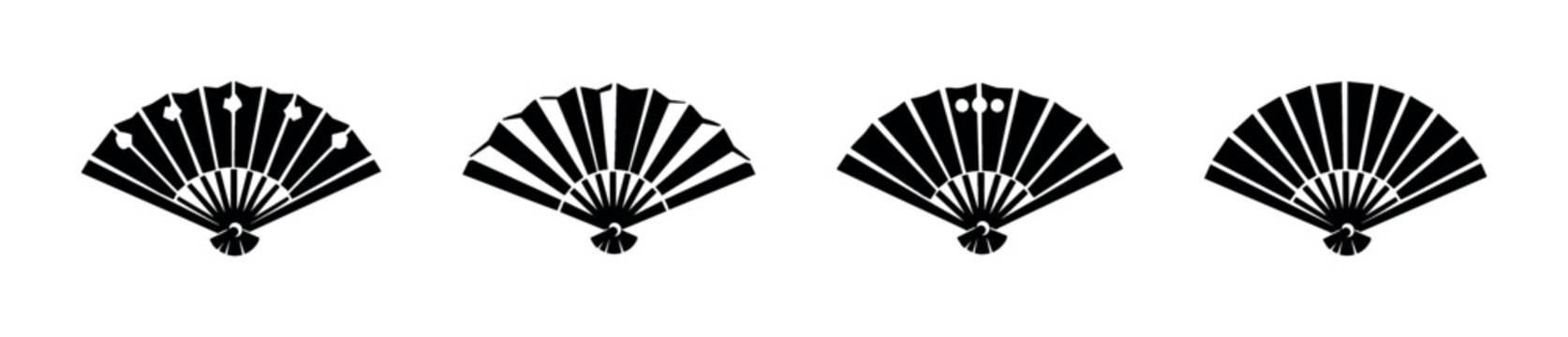 Collection of four black traditional Japanese folding fans with unique patterns