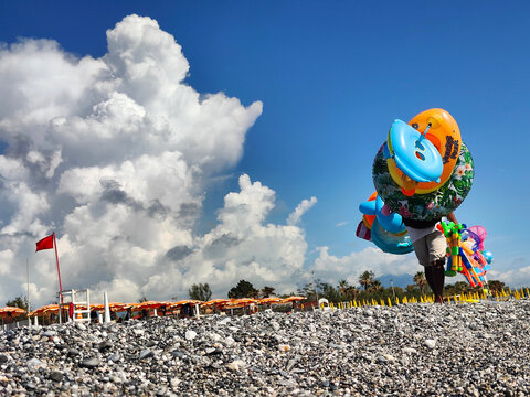 Beach Vendor Inflatables Dramatic Clouds Low Angle Scalea Calabria Italy