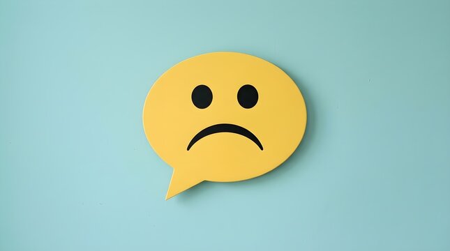 Depiction of a displeased customer using a paper cut emoticon for illustrating negative feedback