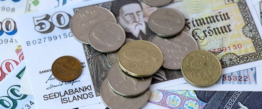 Icelandic krona money bills and coins on table. Iceland cash of ISK currency close up