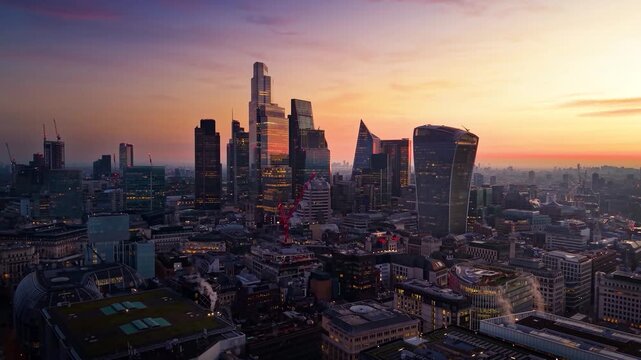 Panoramic aerial view of the financial district City of London, England, cluster skyline during a beautiful sunrise