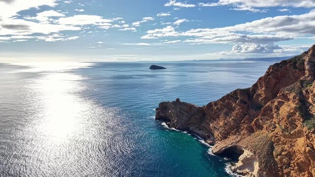 Sunlit Cliff And Island Seascape Calm, Rocky Promontory With Turquoise Cove, Shimmering Sunpath On Water,