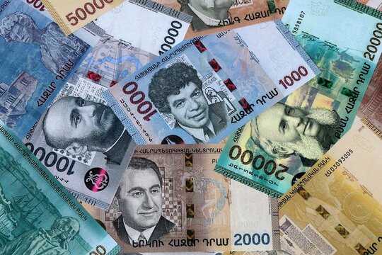 Armenian dram money banknotes bunch on table. Armenia bills of AMD currency close up