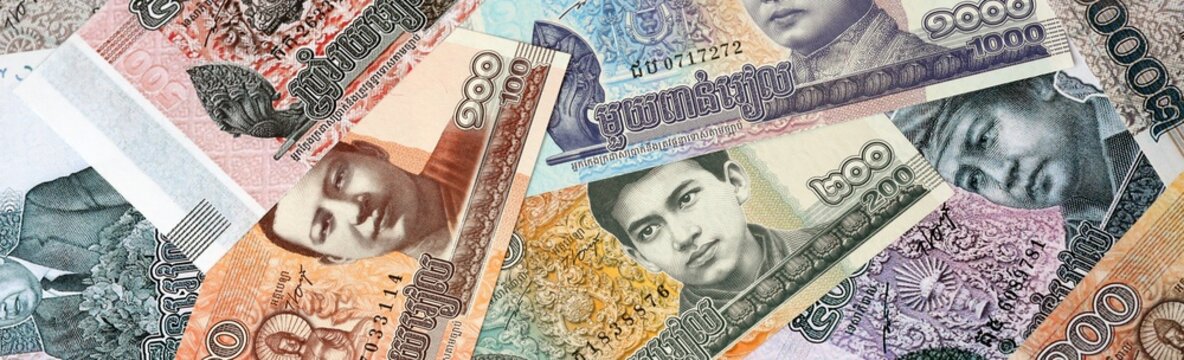 Cambodian riel money bills in pile on table. Cambodia KHR currency cash close up