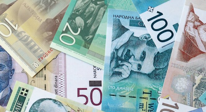Serbian dinar money bills in pile on table. Serbia RSD currency cash close up