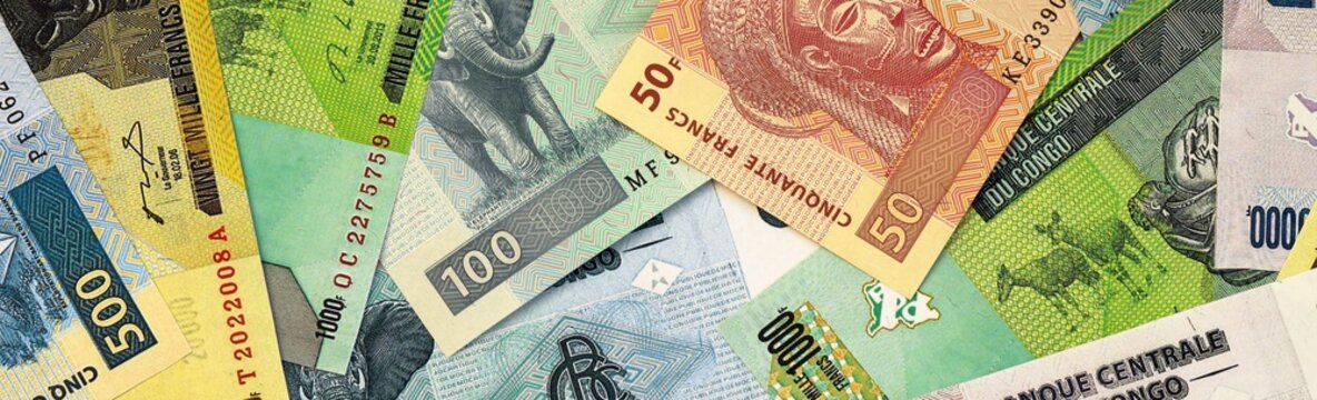Congolese franc money bills in pile on table. Republic of the Congo XAF currency cash close up