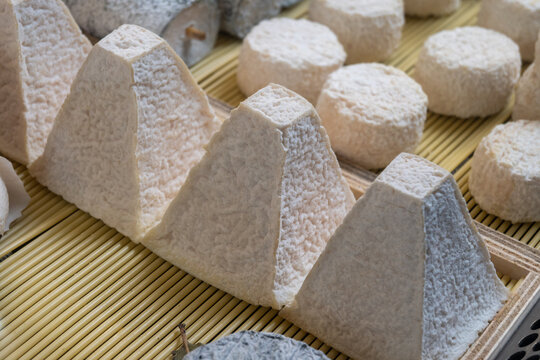 Pouligny-Saint-Pierre AOC goat cheese with its distinctive pyramid shape. Creamy, tangy artisanal French cheese from the Loire Valley with white mold rind, gourmet delicacy, France