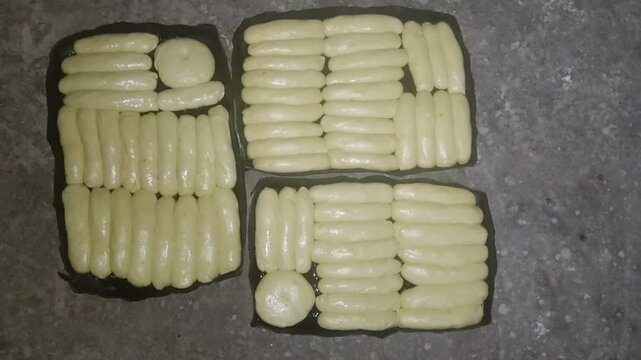 Top View of Three Trays of Raw Egyptian Fayesh Dough
