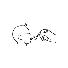 Naklejka premium Baby eating with spoon.