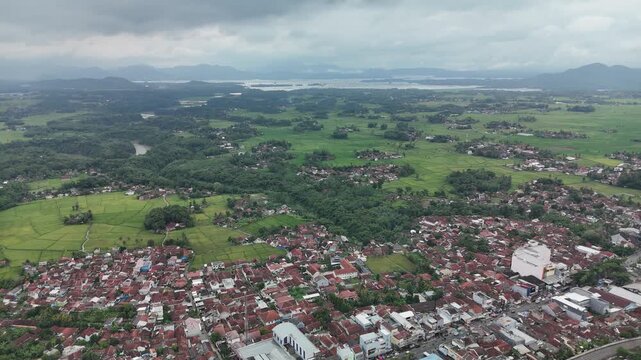 Aerial View of Residential Area Rice Fields and Reservoir in Cianjur West Java Indonesia