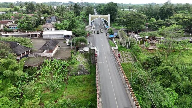 Drone Forward Flight Over Bridge and Rural Village in Cianjur West Java Indonesia