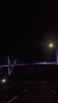 bridge at night the Abdoun Bridge in Amman, Jordan, known for its distinctive Y-shaped pillars and cable-stayed design.