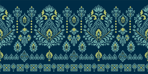 Elegant ethnic floral border seamless pattern on dark teal background. Luxury traditional damask and paisley ornament in lime green and mint blue colors. Exotic vintage design perfect for fabric print © Thitichot