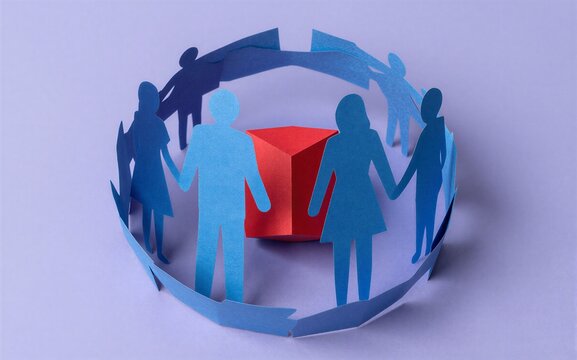 Blue paper cutouts form circle around red cube, symbolizing unity and support.