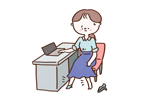 Woman taking off one shoe due to swollen legs from sitting at a desk, office fatigue or poor circulation concept