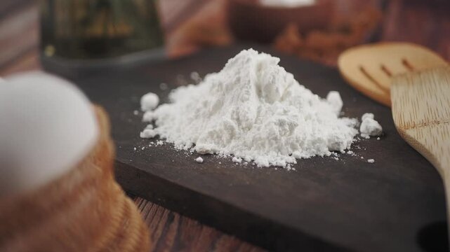 Cooking with flour on a wooden board in the kitchen