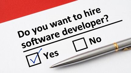 Obraz premium Hiring software developer decision checklist with yes no options on red paper