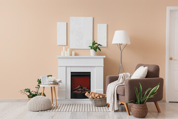 Obraz premium Cozy living room interior with electric fireplace, comfortable armchair, and modern home decor elements
