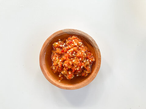 Sambal ulek in wooden bowl, overhead view