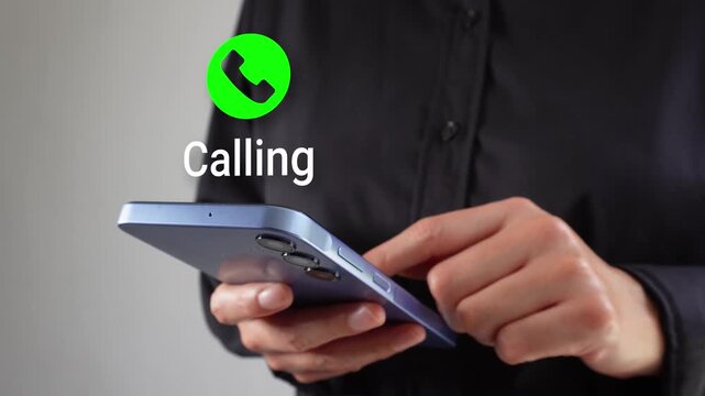 Businesswoman with smartphone in hand with an animated call
