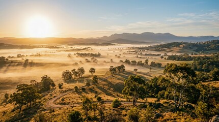 Fototapeta premium Golden hour aerial view of rural farmland and rolling hills.