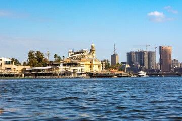 Naklejka premium February 19, 2026, Cairo, Egypt, the full-flowing Nile River. The largest city in the Middle East and Africa. View from a pleasure boat.