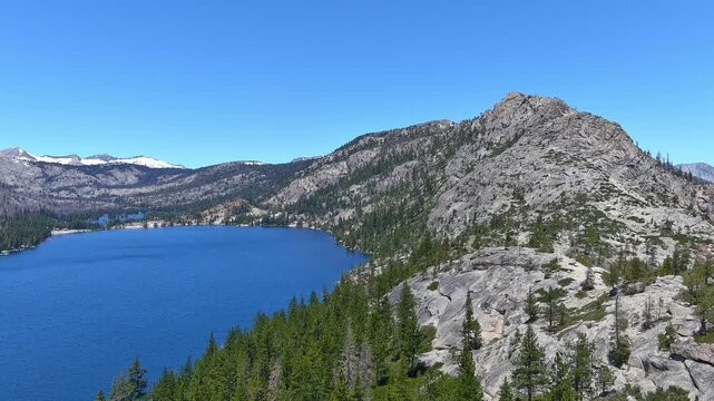 Echo Lakes and summit with desolation wilderness taken from a aerial point of view. The burn scars from the 2022 Caldor fire are evident and the forest hasn&rsquo;t recovered yet. Views also of  Lake Tahoe.