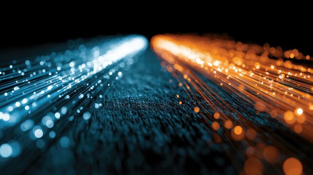 Two streams of light particles, blue on left, orange on right, diverge