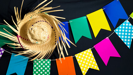 Brazilian June festival decoration. Colorful flags, straw hat and Brazilian flag.