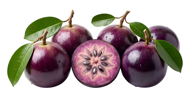 Fresh purple star apple fruits with green leaves and one sliced half showing star pattern inside
